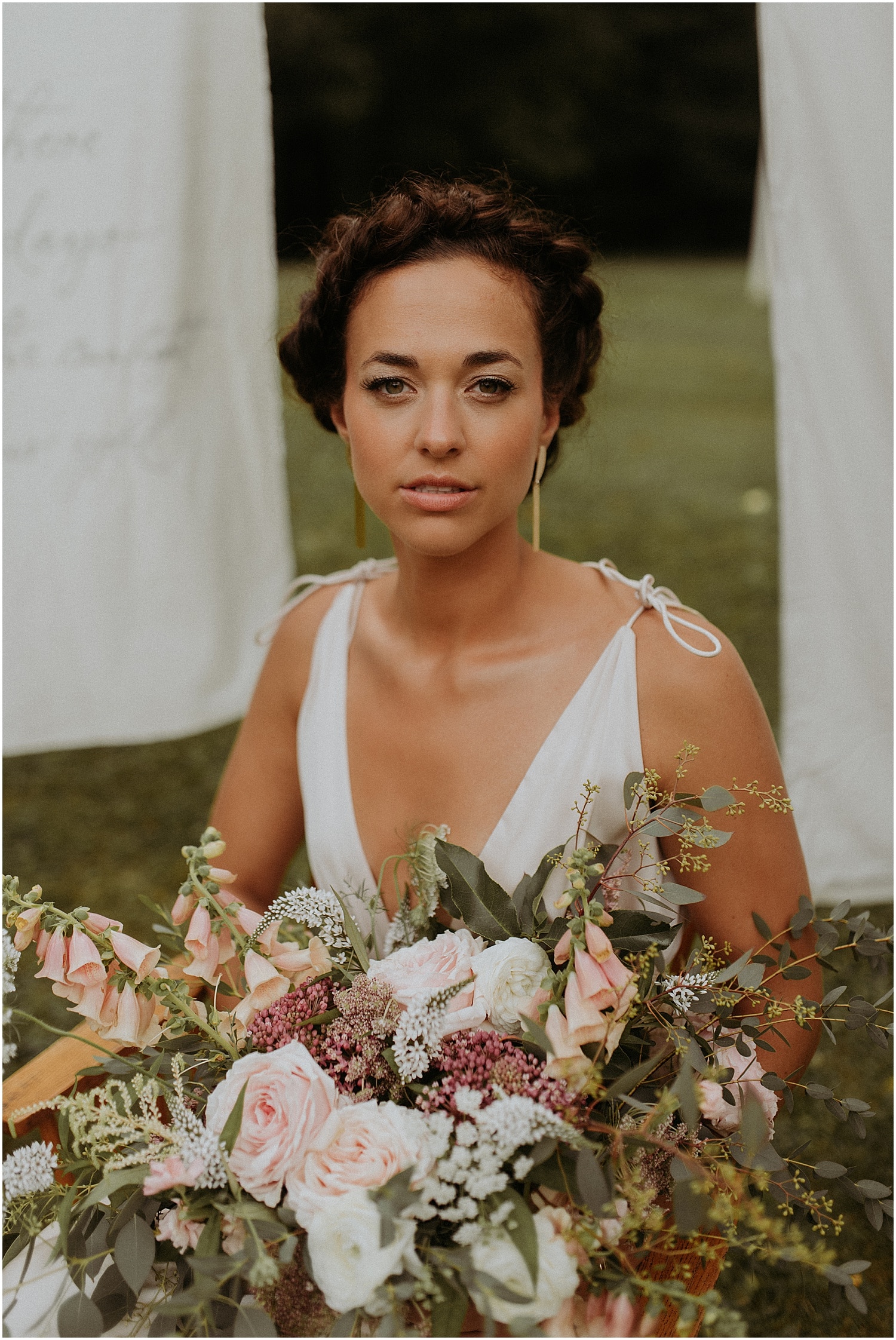 Bride holding a wild bouquet close up