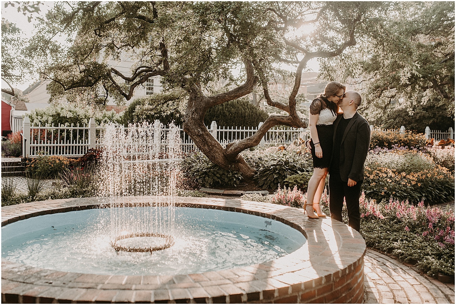 Couple kissing in a garden at their Portsmouth Engagement Photography