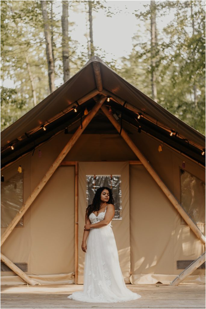 bride in front of camping cabin