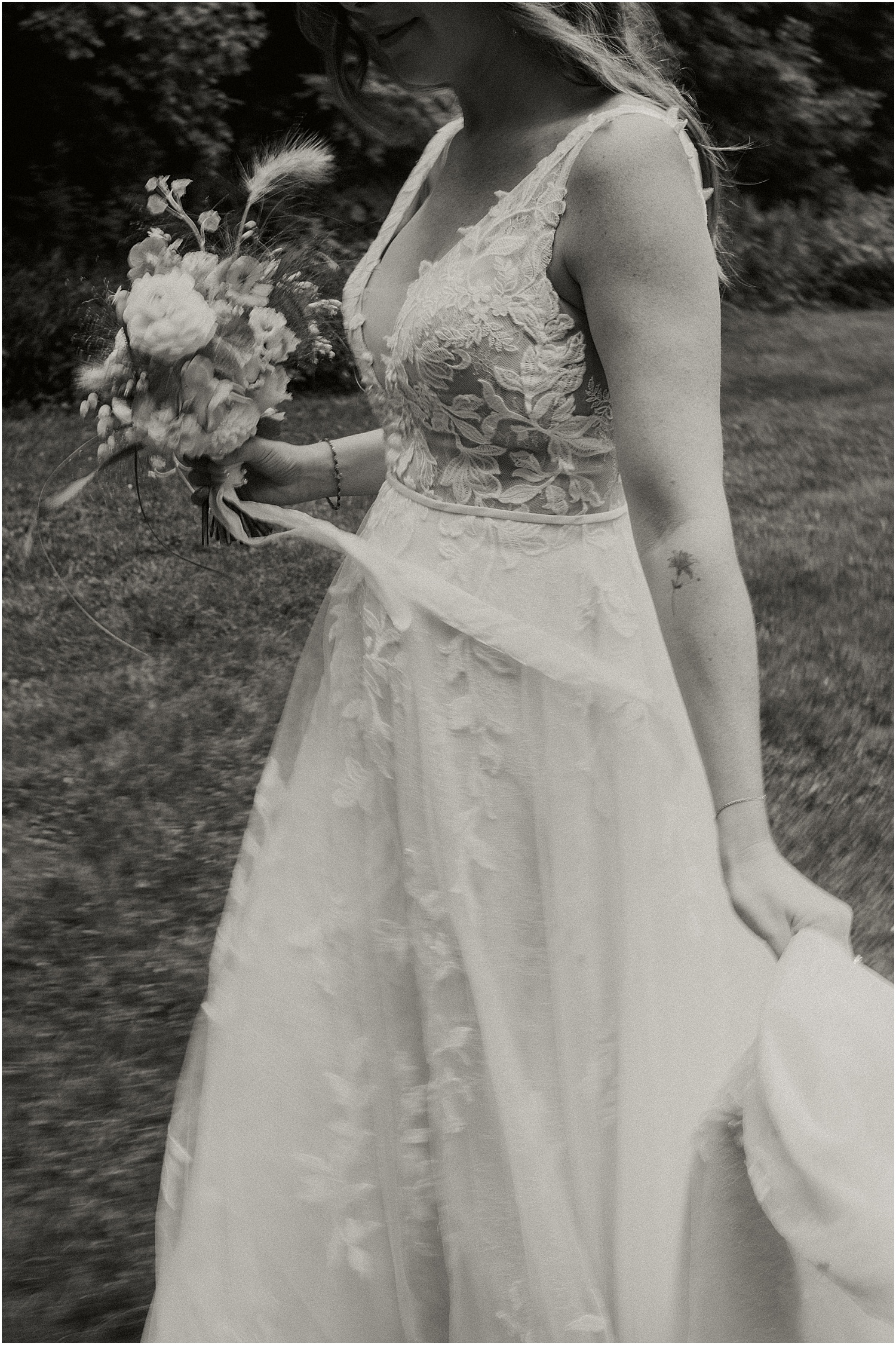 Bride holds dress for Caswell Farm Wedding Photographer