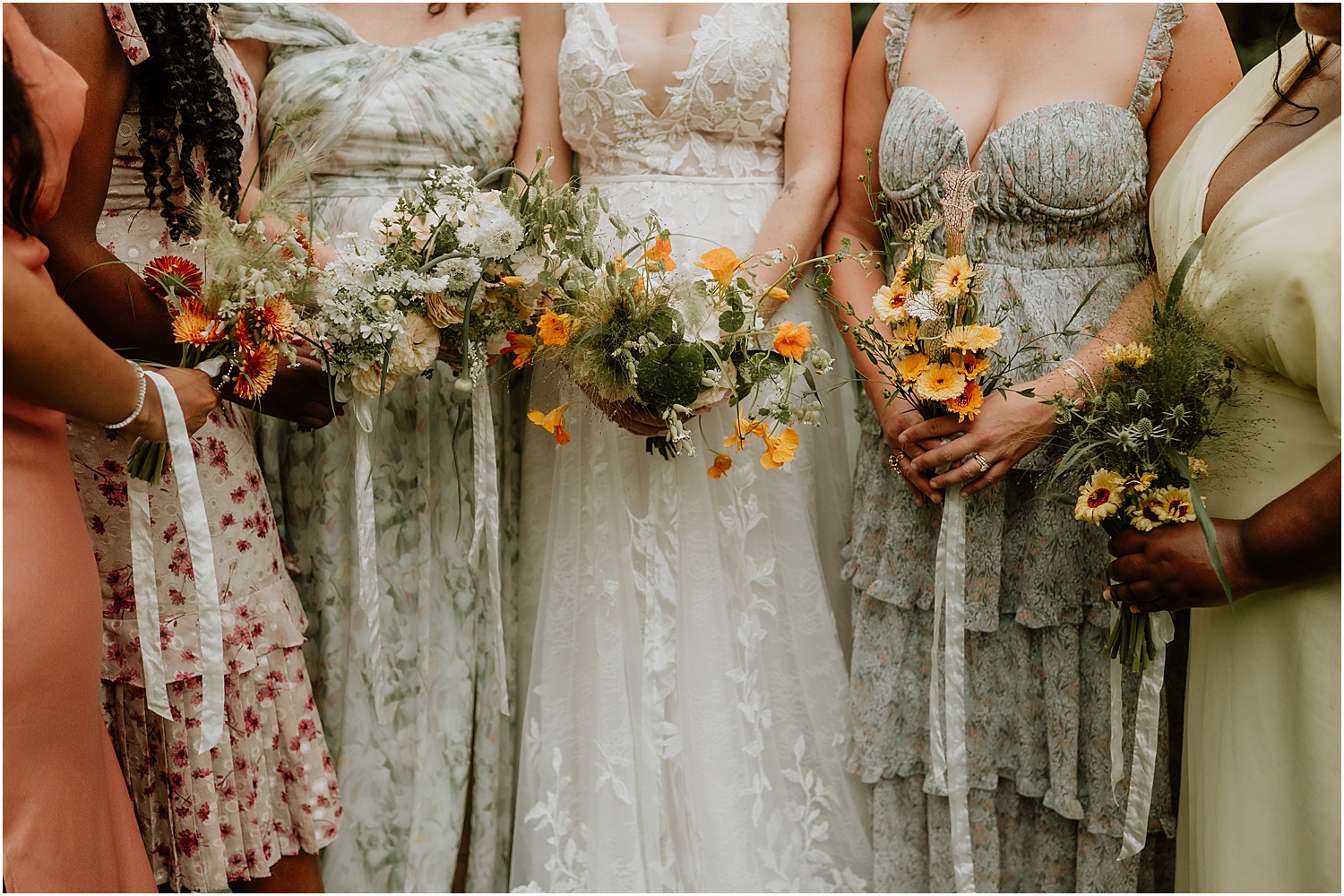 Bridesmaids holding bouquet at Caswell Farm Wedding Photographer