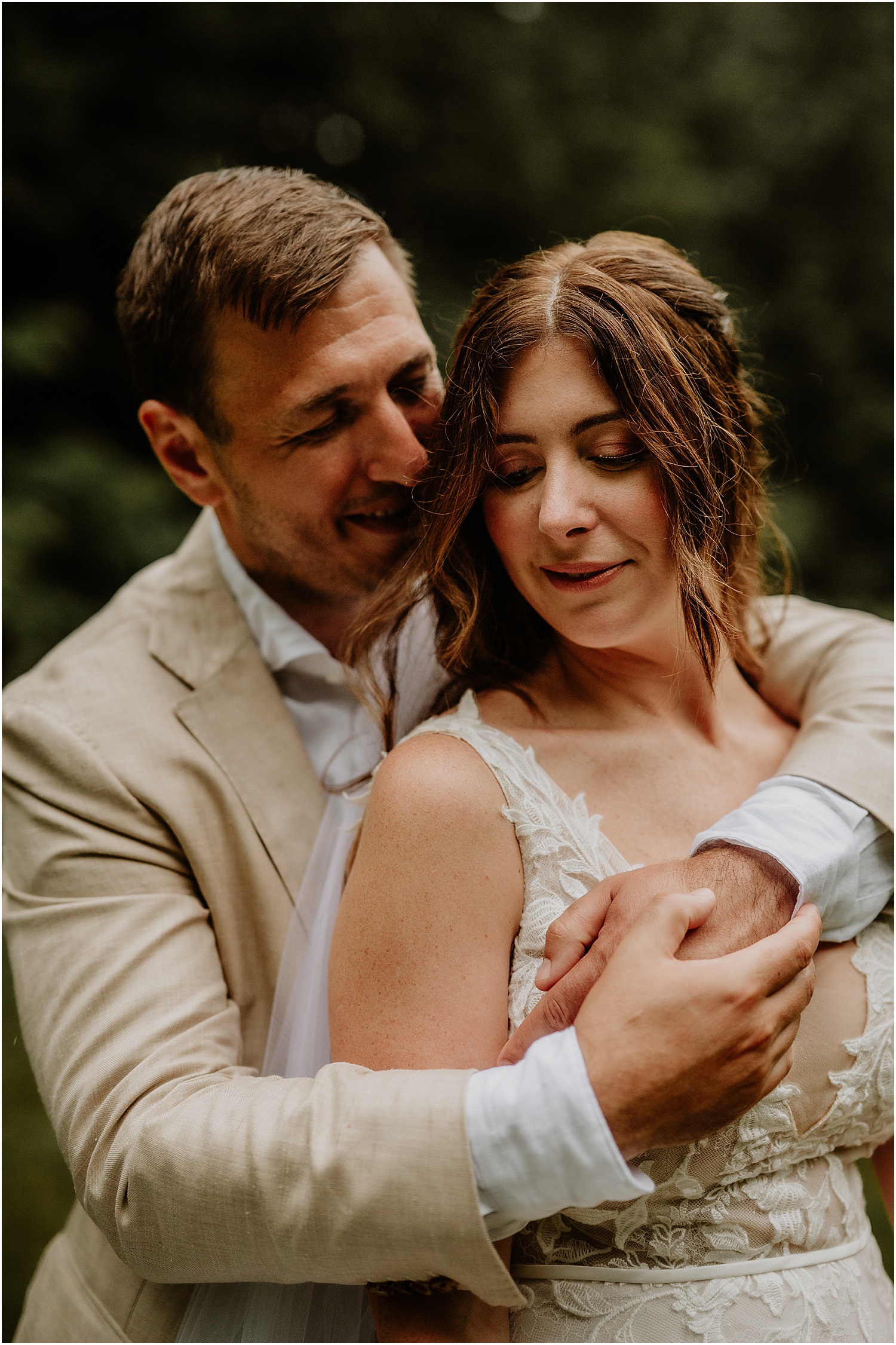 Bride and groom share a hug for Katelyn Mallett Photography