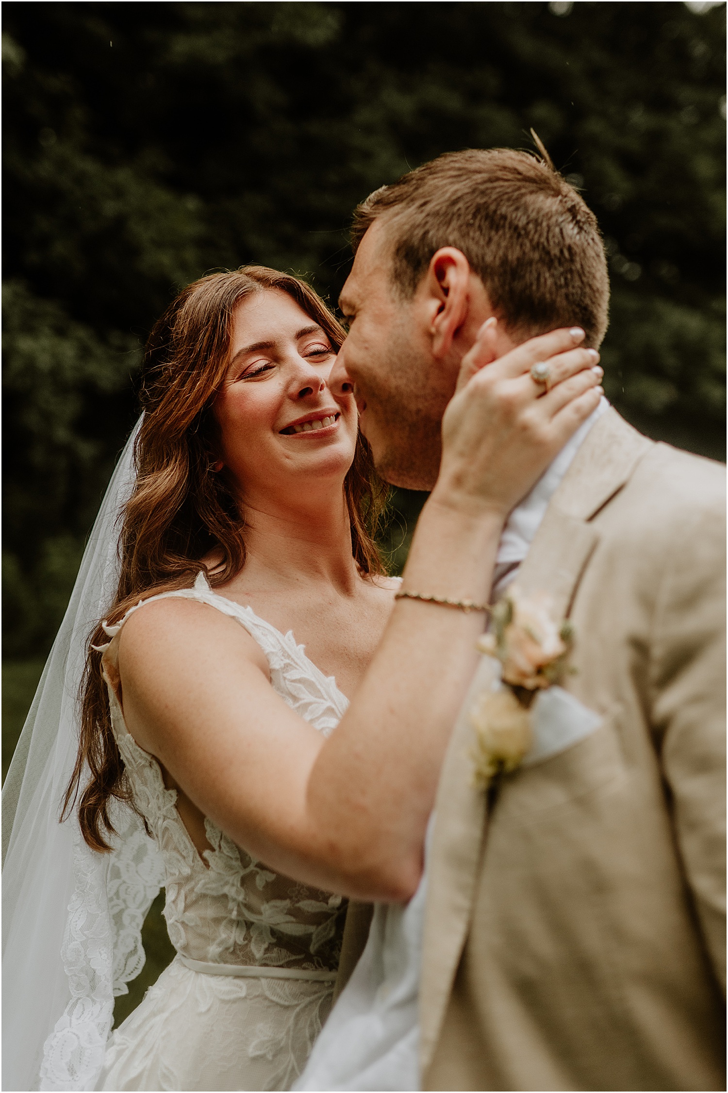 Bride brings groom in close for Maine Wedding Photographer
