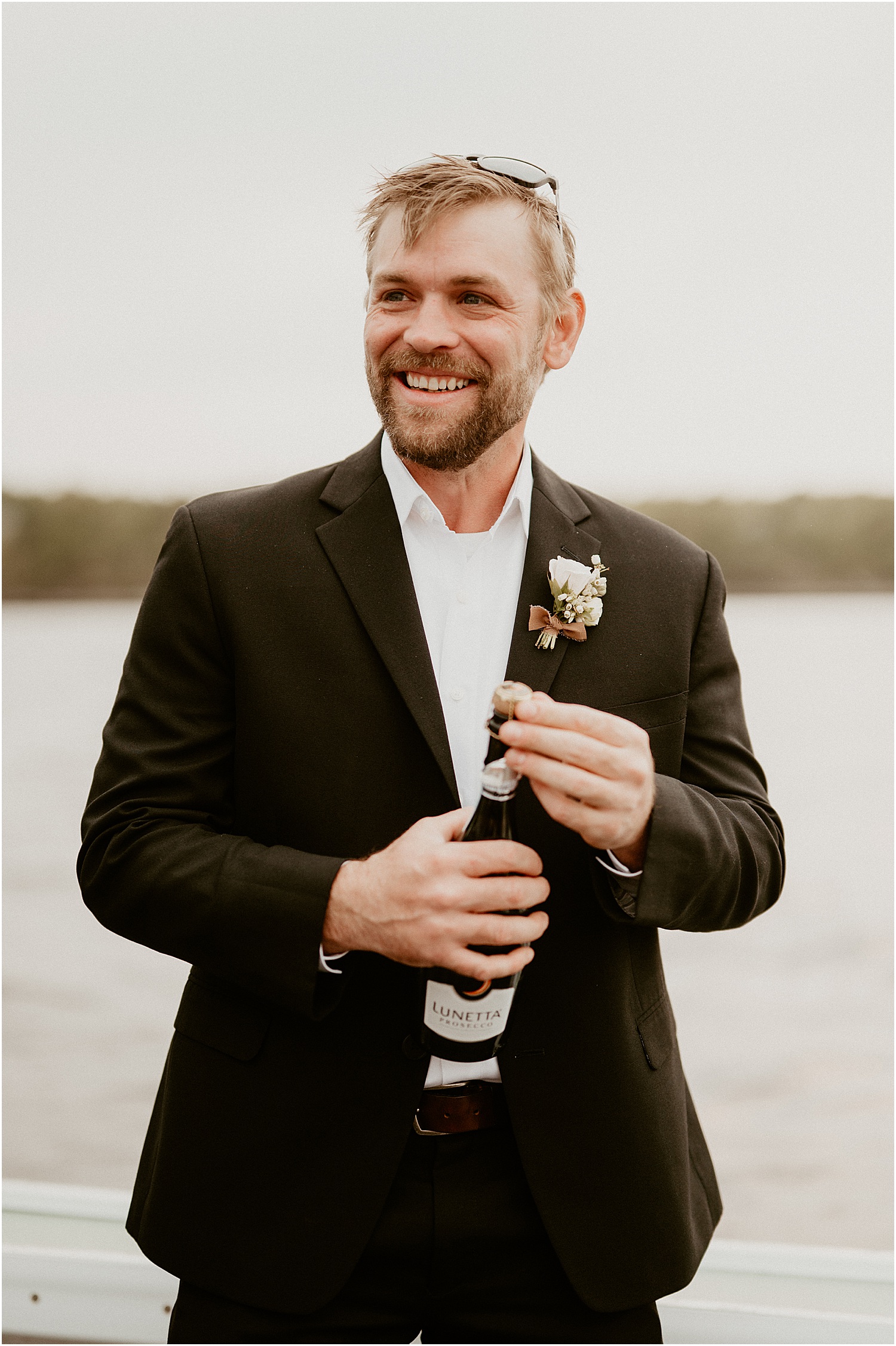 Groom gets ready for wedding on Just Banded Lobster Boat Elopement