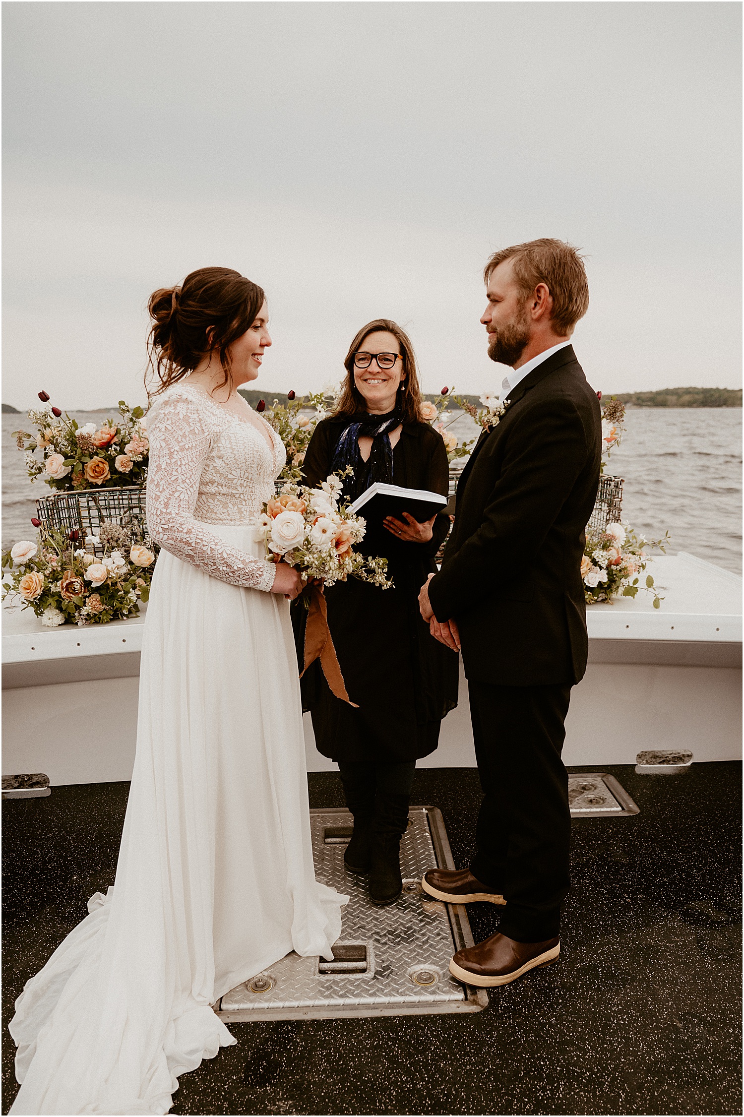 Couple exchanges their vows on Just Banded Lobster Boat Elopement