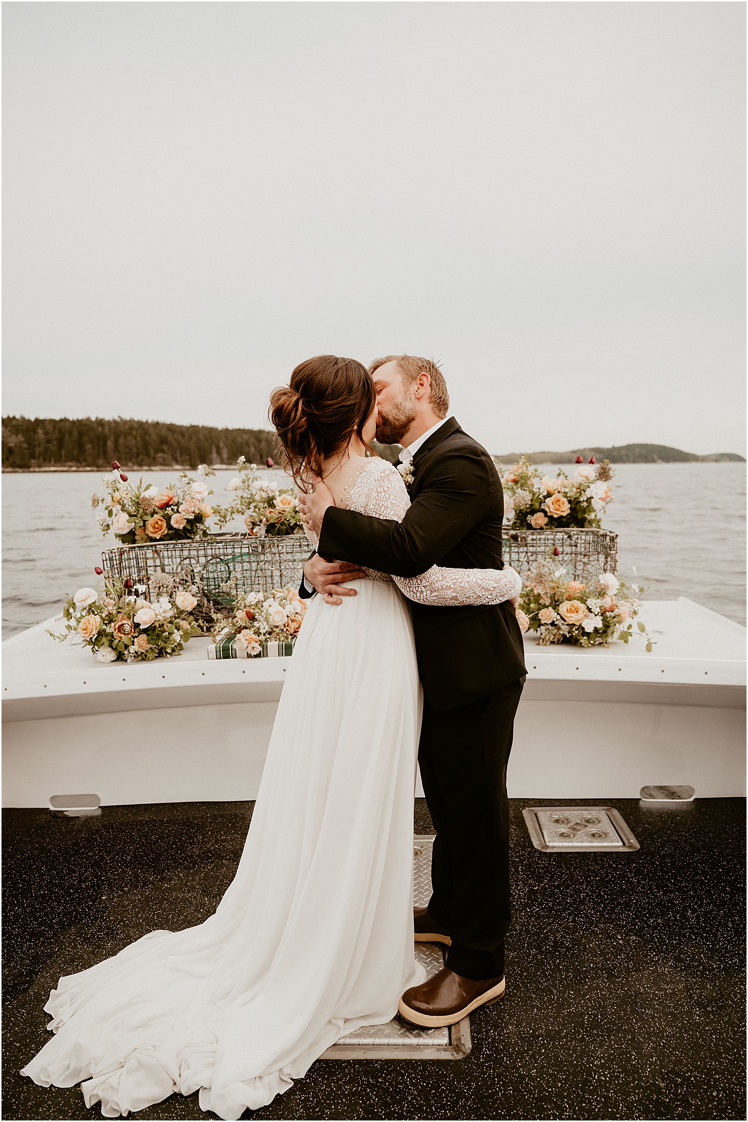 First kiss as husband and wife on Just Banded Lobster Boat Elopement