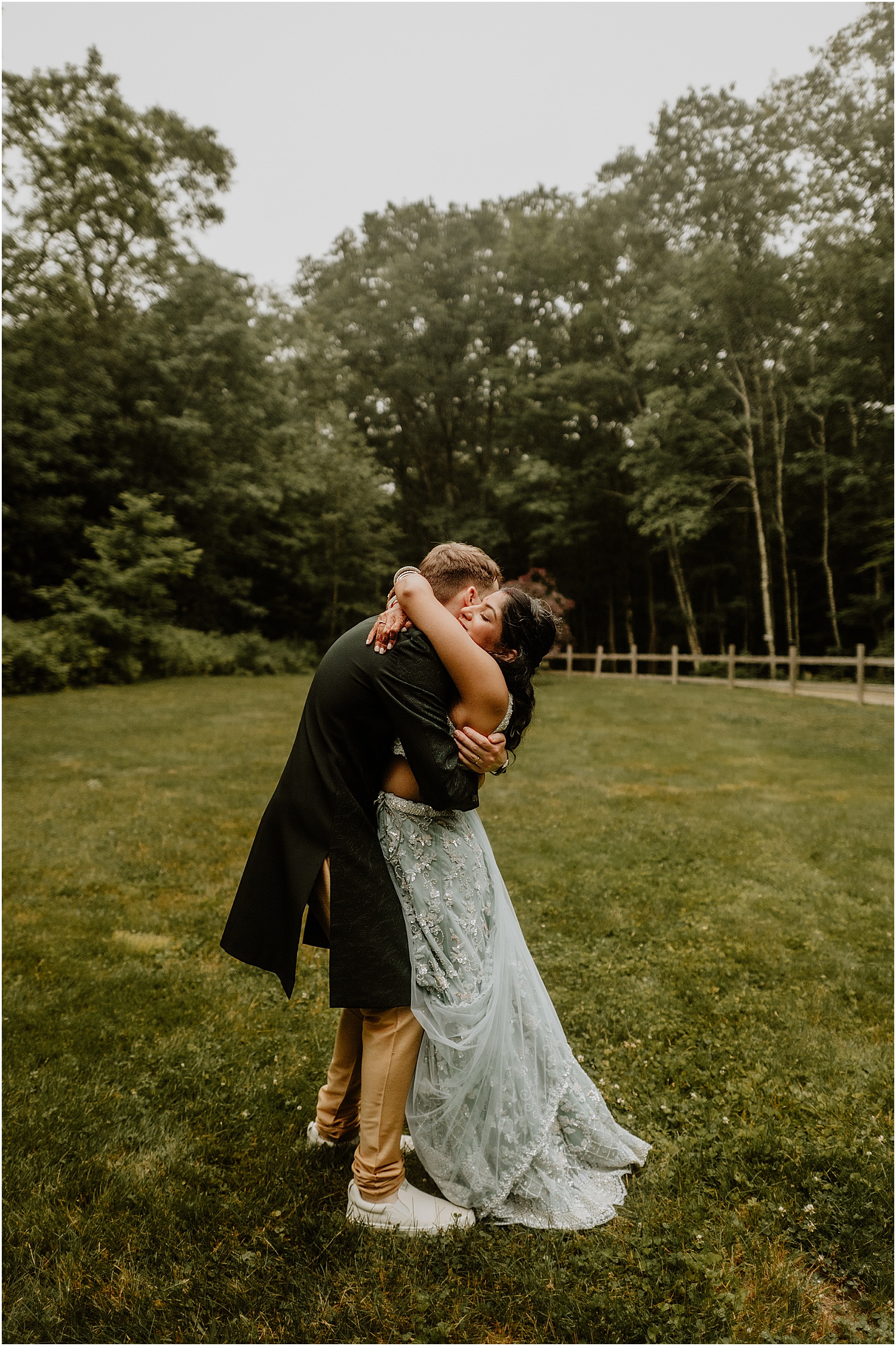 Husband and wife share a kiss for Katelyn Mallett Photography